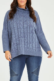 Model Laura wearing size M-L of the Cool Breeze Cable Sweater in colour Denim (Blue), from the front, cropped image