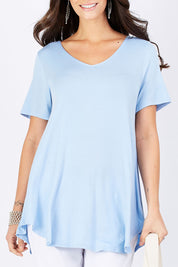 Model Georgia wearing size 10 of the Softly Swinging Bamboo Tee in colour Chambray (Blue), from the front, cropped image