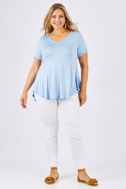 Model Ljubenka wearing size 18 of the Softly Swinging Bamboo Tee in colour Chambray (Blue), from the front, showing the whole outfit
