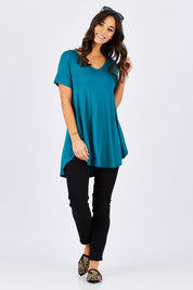 Model Georgia wearing size 10 of the Softly Swinging Bamboo Tee in colour Jewel (Green), from the front, showing the whole outfit