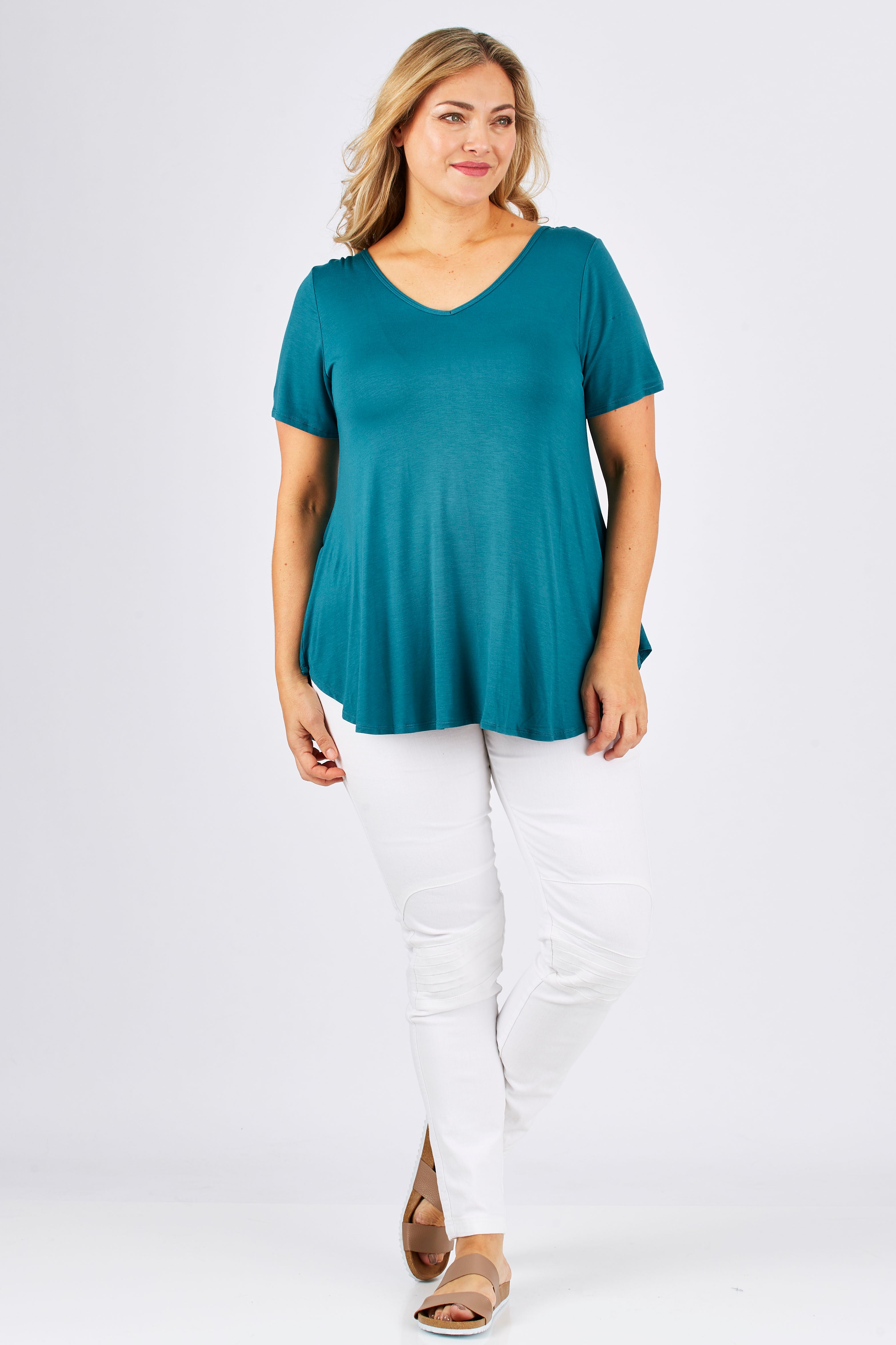 Model Ljubenka wearing size 18 of the Softly Swinging Bamboo Tee in colour Jewel (Green), from the front, showing the whole outfit
