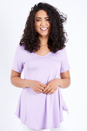 Model Pamela wearing size 10 of the Softly Swinging Bamboo Tee in colour Lilac (Purple), from the front, cropped image