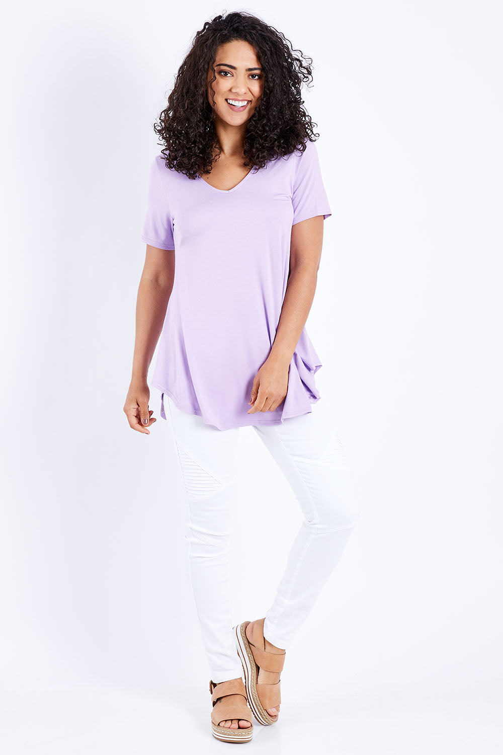 Model Pamela wearing size 10 of the Softly Swinging Bamboo Tee in colour Lilac (Purple), from the front, showing the whole outfit