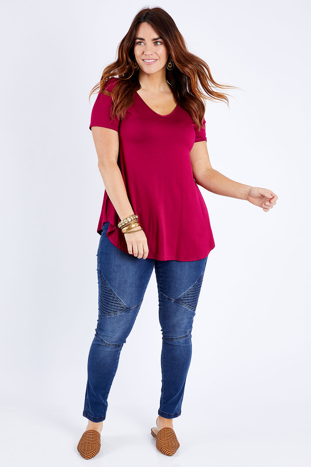 Model Laura wearing size 14 of the Softly Swinging Bamboo Tee in colour Ruby (Red), from the front, showing the whole outfit