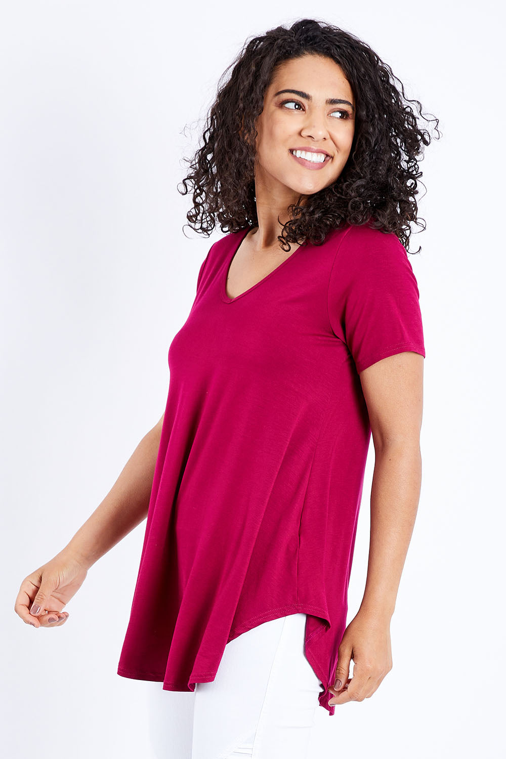 Model Pamela wearing size 10 of the Softly Swinging Bamboo Tee in colour Ruby (Red), from the front, cropped image
