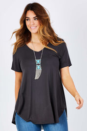 Model Laura wearing size 12 of the Softly Swinging Bamboo Tee in colour Storm (Grey), from the front, cropped image
