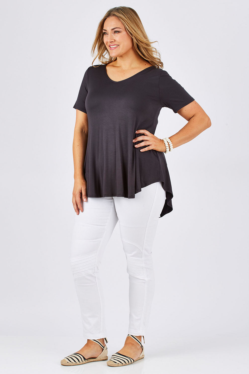 Model Ljubenka wearing size 18 of the Softly Swinging Bamboo Tee in colour Storm (Grey), from the front, showing the whole outfit