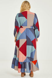 Model Katie wearing size 16 of the La Dolce Vita Print Wrap Dress in colour Geoblue (Blue), from the back