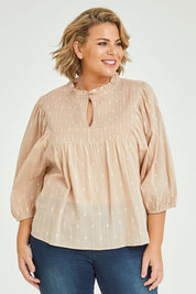 Model Fiona wearing size 16 of the Delighted To Meet You Blouse in colour Sand, from the front, cropped image