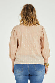 Model Jess wearing size 14 of the Delighted To Meet You Blouse in colour Sand, from the back