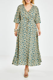 Model Jess wearing size 14 of the Daisy Chain Swing Dress in colour Daisy (Blue), from the front, cropped image