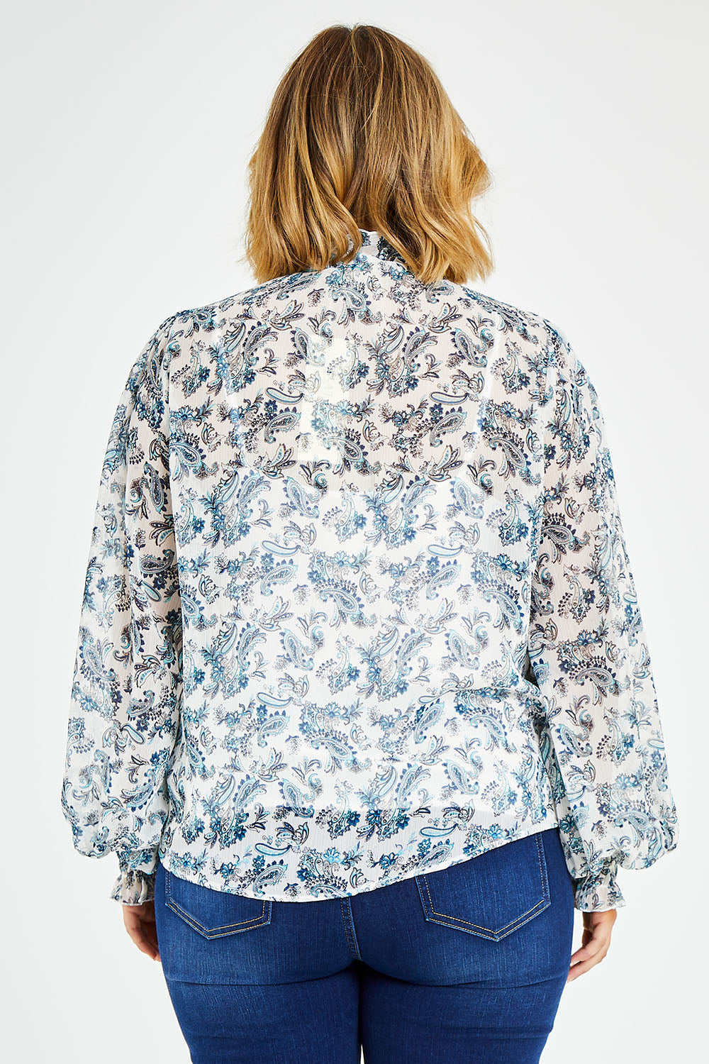 Model Jess wearing size 14 of the Paisley Lady Blouse in colour Whtpaisley (White), from the back