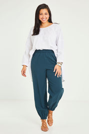 Model Terri-Leigh wearing size 14 of the Dawn Break Relaxed Pants in colour Ocean (Blue), from the front, showing the whole outfit