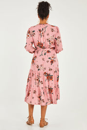 Model Noli wearing size 14 of the Pocket Full Of Dreams Wrap Dress in colour Hibiscus (Pink), from the back