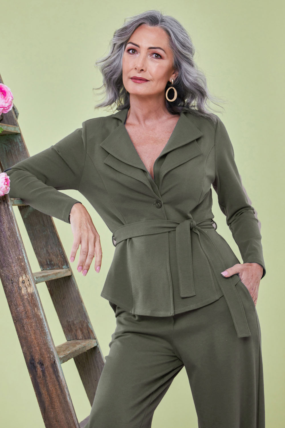 Model Luisa wearing size 10 of the Femme Fatale Ponte Jacket in colour Moss (Green), from the front, showing the whole outfit