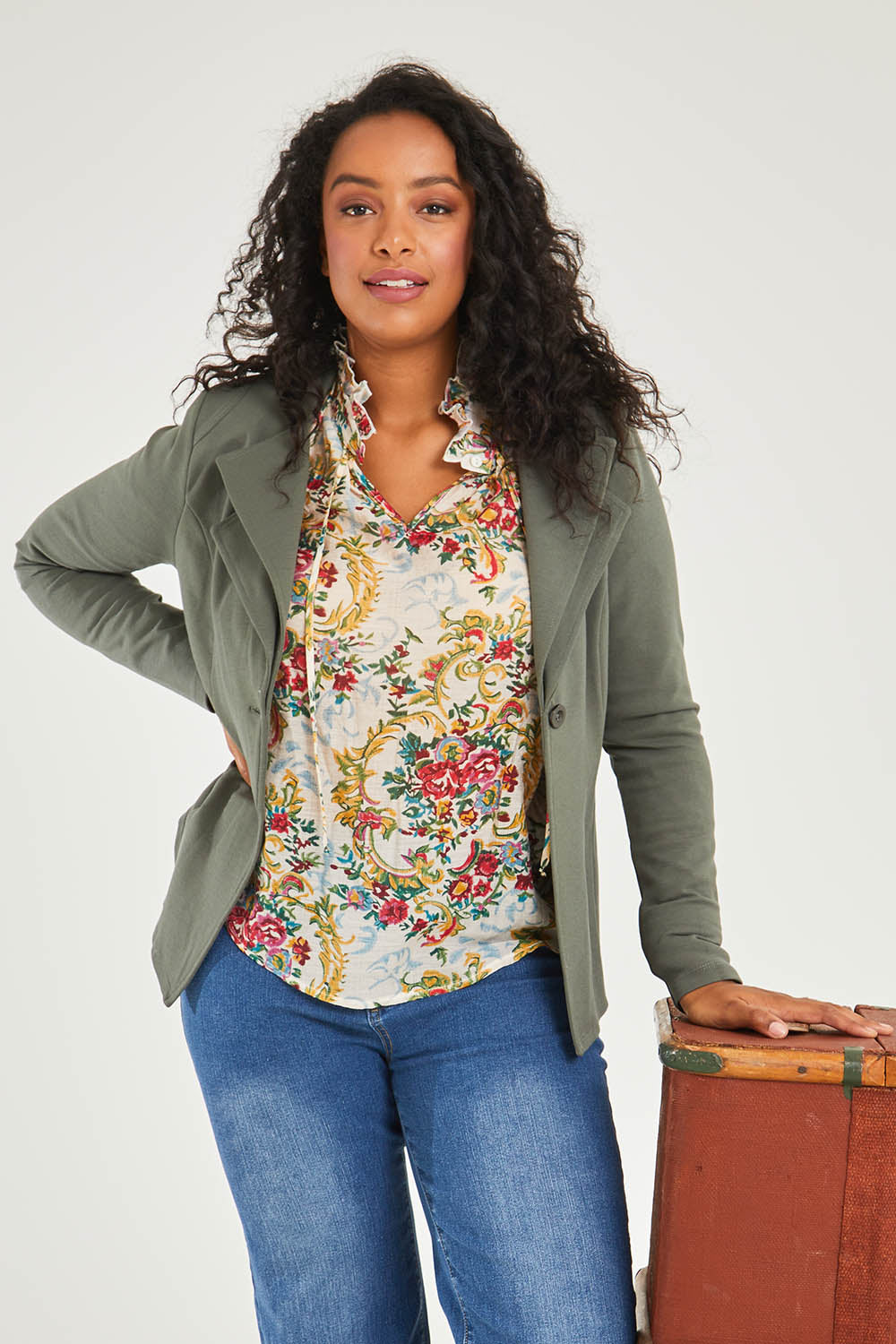 Model Noli wearing size 14 of the Femme Fatale Ponte Jacket in colour Moss (Green), from the front, cropped image