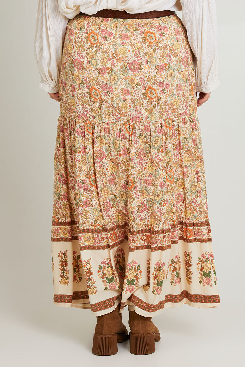 Model Laura wearing size 14 of the Chasing Sunsets Skirt in colour Bonefleur, from the back