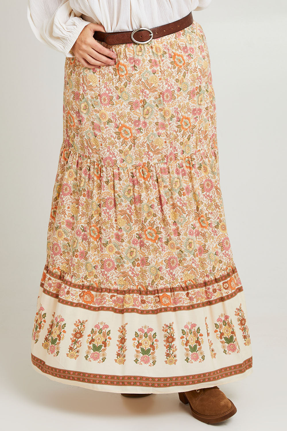 Model Laura wearing size 14 of the Chasing Sunsets Skirt in colour Bonefleur, from the front, cropped image