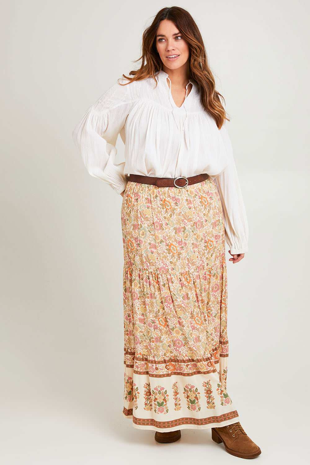 Model Laura wearing size 14 of the Chasing Sunsets Skirt in colour Bonefleur, from the front, showing the whole outfit