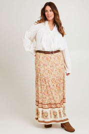Model Laura wearing size 14 of the Chasing Sunsets Skirt in colour Bonefleur, from the front, showing the whole outfit