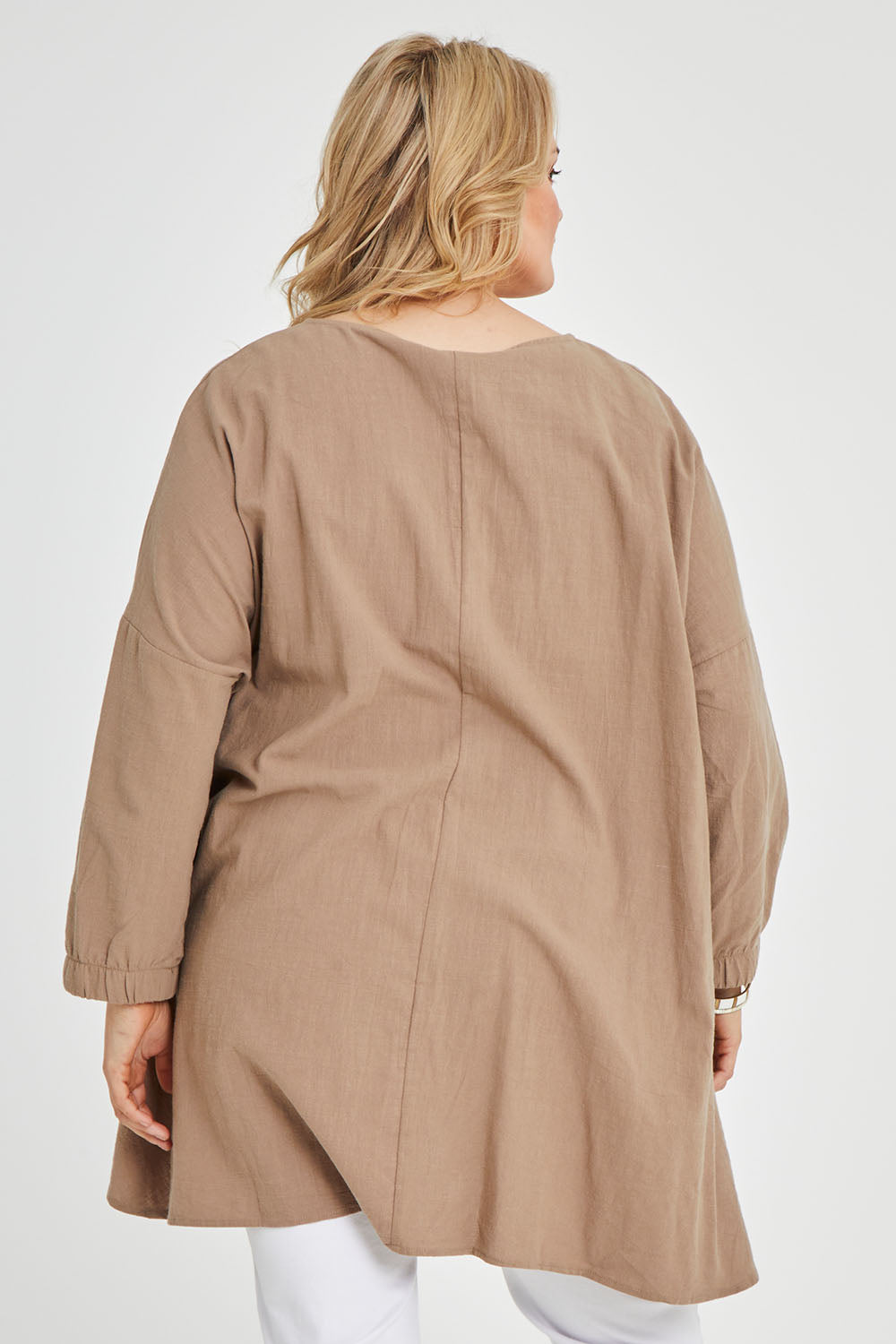 Model Keeara wearing size 16 of the Good Times Gather Top in colour Latte, from the back