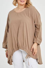 Model Keeara wearing size 16 of the Good Times Gather Top in colour Latte, from the front, cropped image