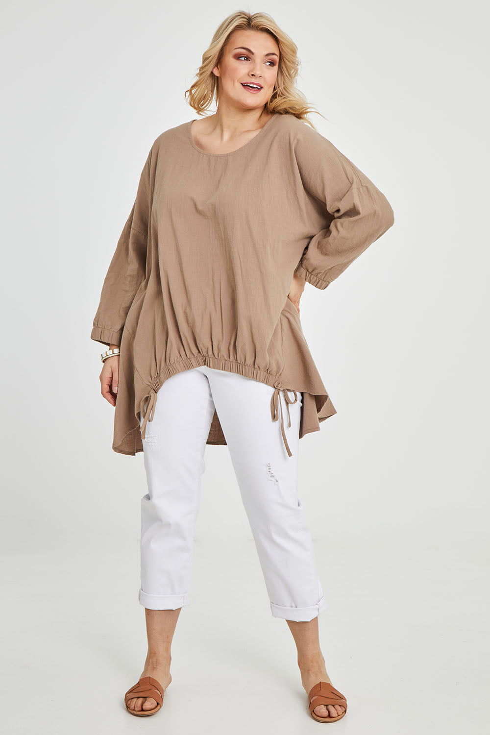Model Keeara wearing size 16 of the Good Times Gather Top in colour Latte, from the front, showing the whole outfit