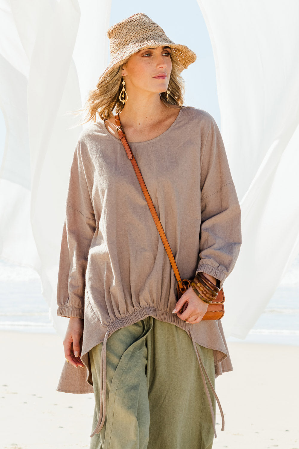 Model Tegan wearing size 10 of the Good Times Gather Top in colour Latte, from the front, showing the whole outfit