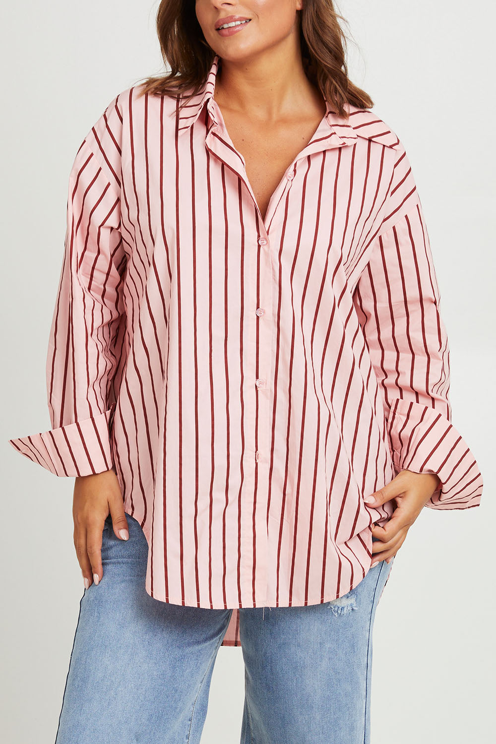 Model Monique wearing size 14 of the Relaxed Elegance Boyfriend Shirt in colour Pinkstripe (Pink), from the front, cropped image