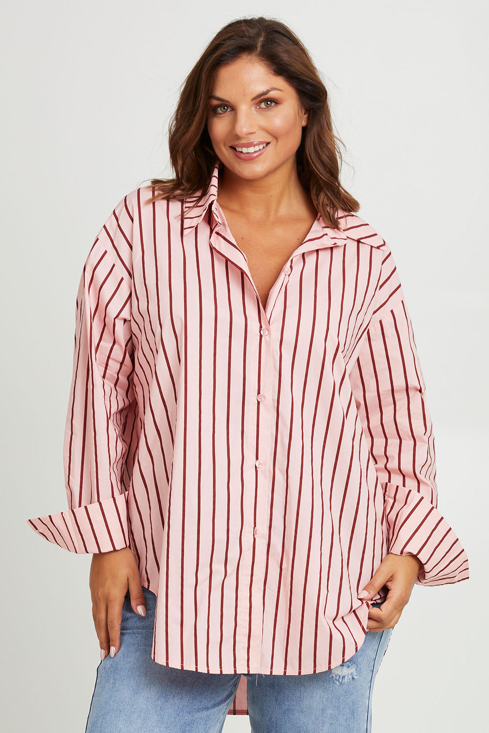 Model Monique wearing size 14 of the Relaxed Elegance Boyfriend Shirt in colour Pinkstripe (Pink), from the front, cropped image