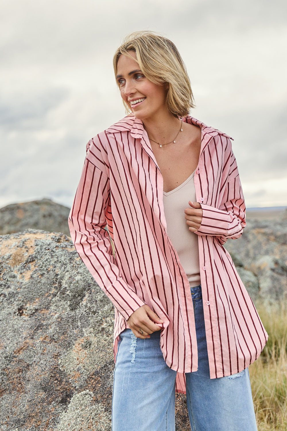 Model Tegan wearing size 10 of the Relaxed Elegance Boyfriend Shirt in colour Pinkstripe (Pink), from the front, showing the whole outfit