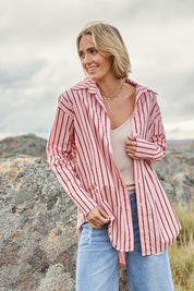 Model Tegan wearing size 10 of the Relaxed Elegance Boyfriend Shirt in colour Pinkstripe (Pink), from the front, showing the whole outfit