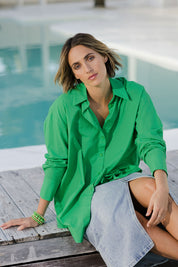 Model Tegan wearing size 10 of the Relaxed Elegance Boyfriend Shirt in colour Emerald (Green), from the front, showing the whole outfit