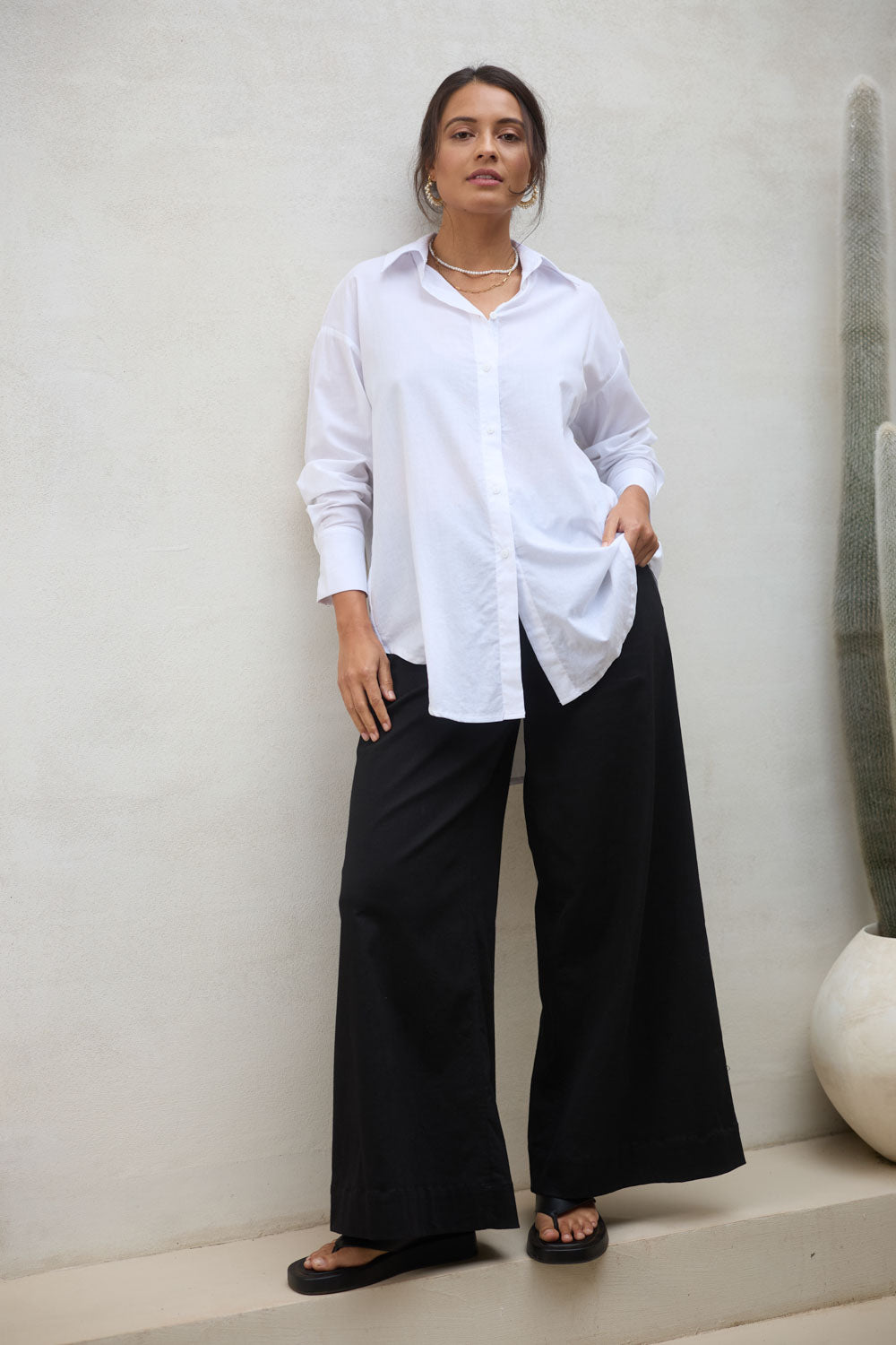 Model Tahnee wearing size 10 of the Relaxed Elegance Boyfriend Shirt in colour White (White), from the front, showing the whole outfit
