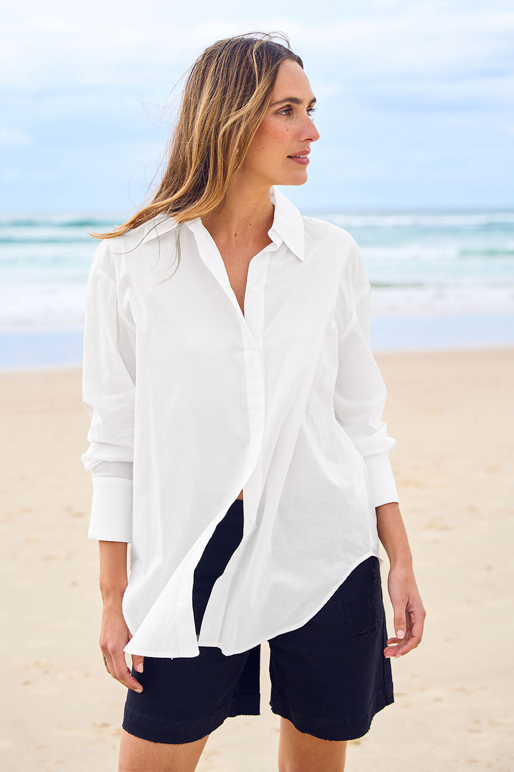 Model Tegan wearing size 10 of the Relaxed Elegance Boyfriend Shirt in colour White (White), from the front, showing the whole outfit