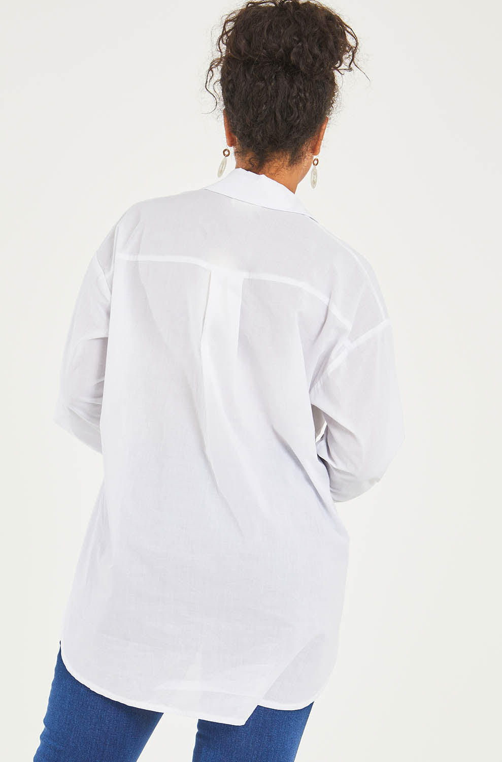 Model Terri-Leigh wearing size 14 of the Relaxed Elegance Boyfriend Shirt in colour White (White), from the back