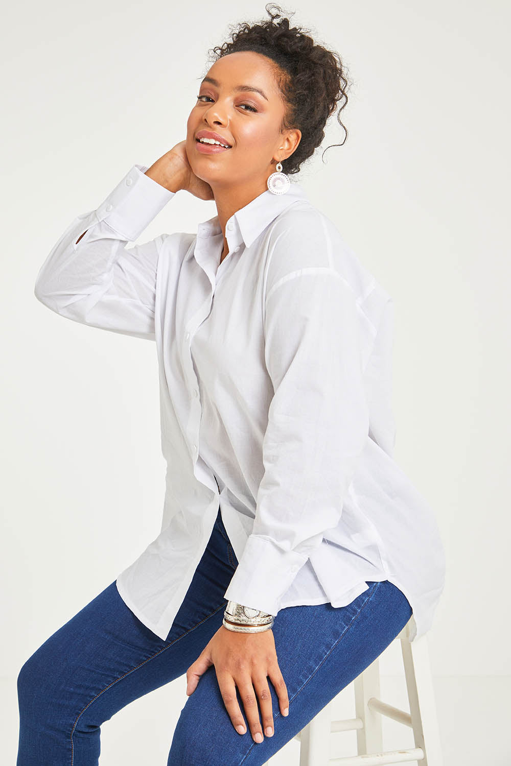 Model Terri-Leigh wearing size 14 of the Relaxed Elegance Boyfriend Shirt in colour White (White), from the front, cropped image