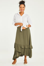 Model Noli wearing size 14 of the Day To Night Flounce Skirt in colour Khaki (Green), from the front, showing the whole outfit