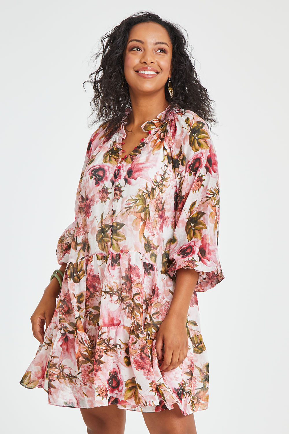 Model Noli wearing size 14 of the Down The Garden Path Dress in colour Fleur (Pink), from the front, cropped image