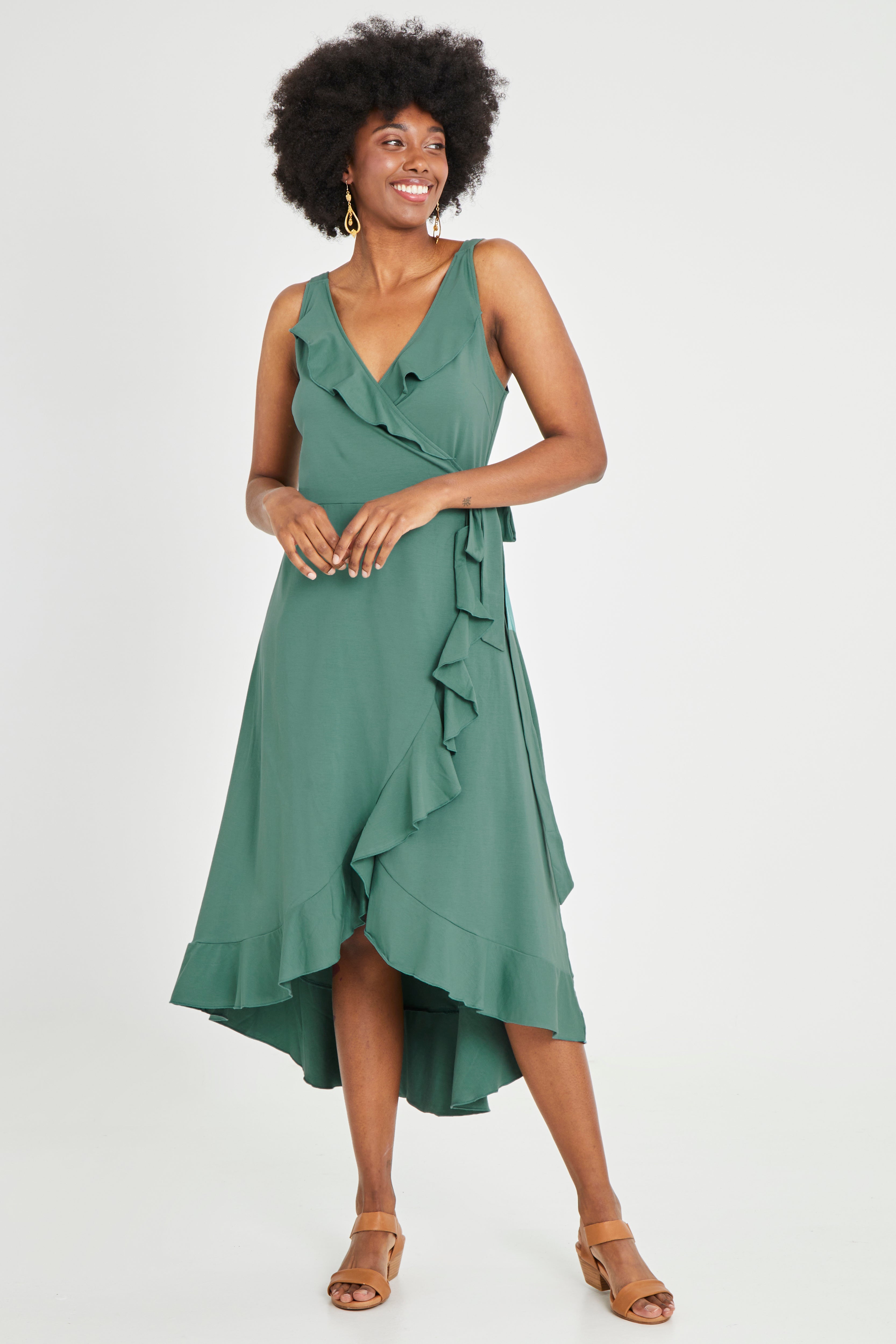 Model Aiyana wearing size 10 of the Thats A Wrap Mercerised Cotton Dress in colour Fern (Green), from the front, showing the whole outfit