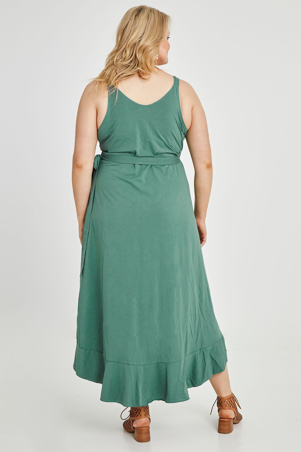 Model Keeara wearing size 16 of the Preloved Thats A Wrap Mercerised Cotton Dress in colour Fern (Green), from the back