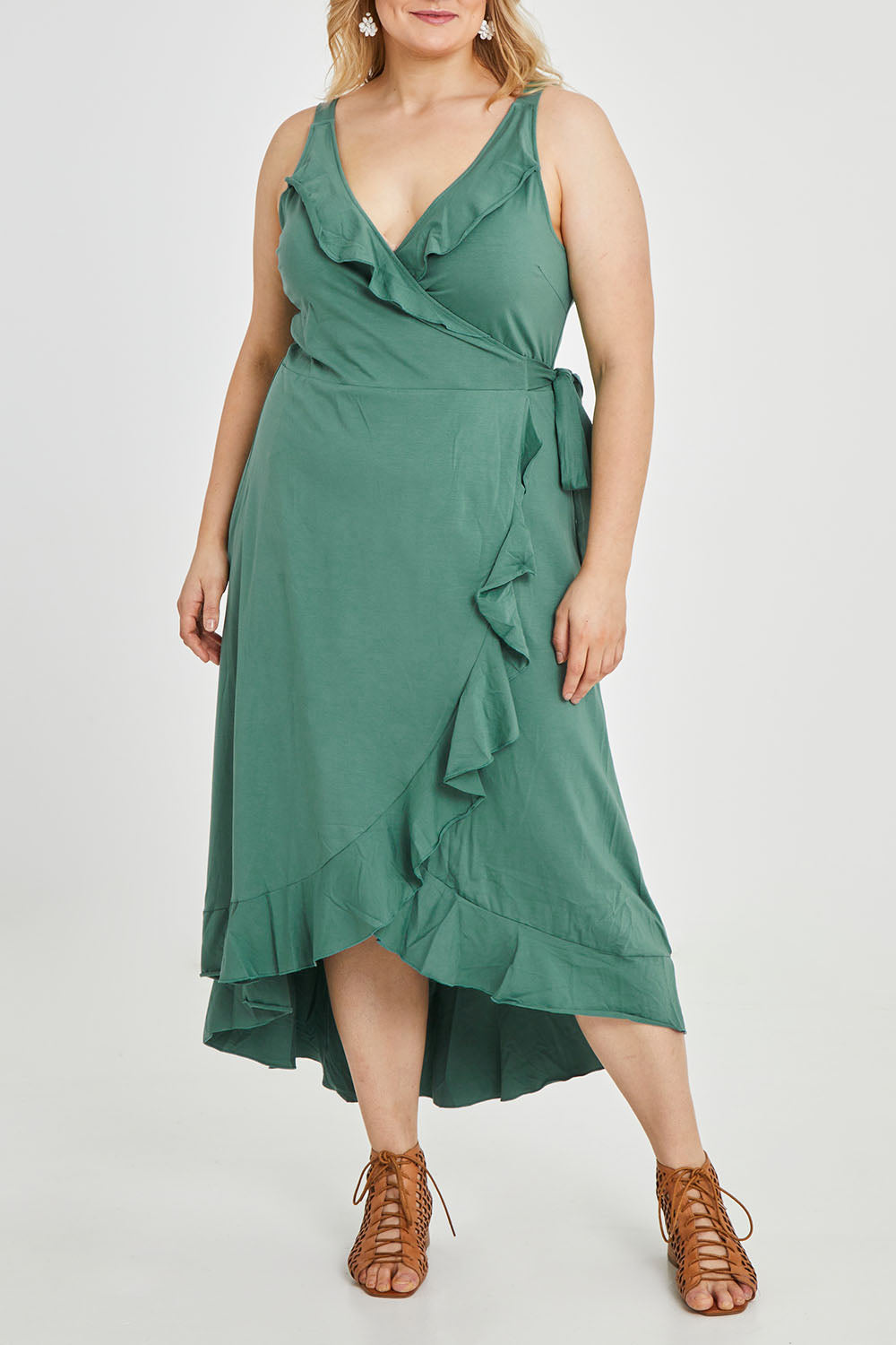 Model Keeara wearing size 16 of the Preloved Thats A Wrap Mercerised Cotton Dress in colour Fern (Green), from the front, cropped image