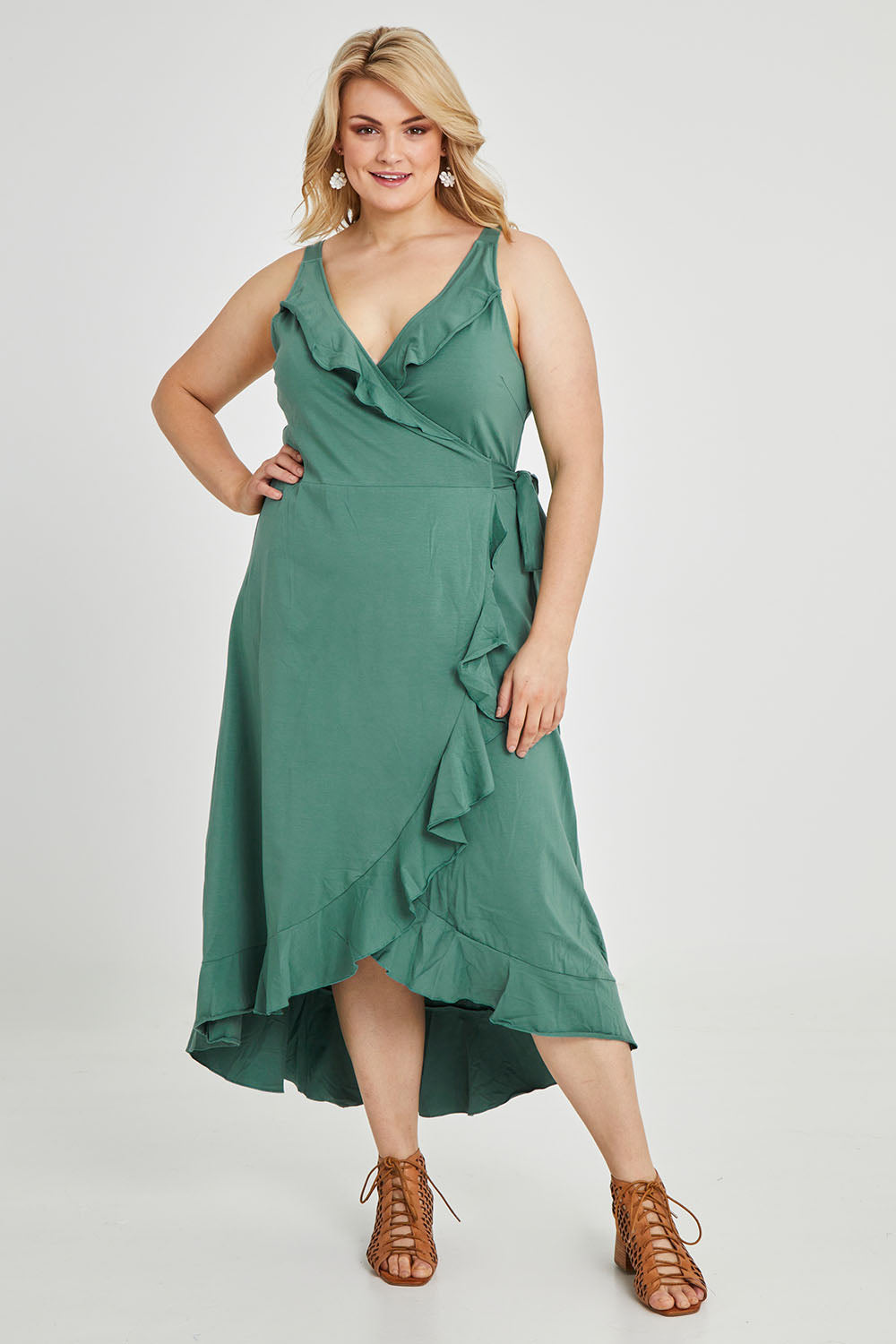 Model Keeara wearing size 16 of the Preloved Thats A Wrap Mercerised Cotton Dress in colour Fern (Green), from the front, showing the whole outfit