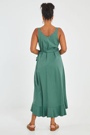 Model Noli wearing size 14 of the Preloved Thats A Wrap Mercerised Cotton Dress in colour Fern (Green), from the back