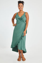 Model Noli wearing size 14 of the Preloved Thats A Wrap Mercerised Cotton Dress in colour Fern (Green), from the front, showing the whole outfit