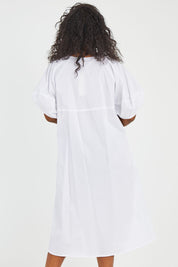 Model Noli wearing size 14 of the Light The Way Lantern Sleeve Dress in colour White (White), from the back