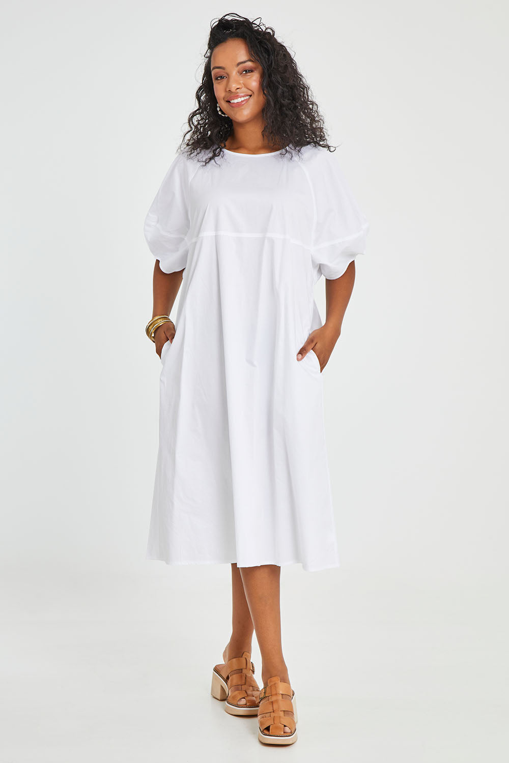 Model Noli wearing size 14 of the Light The Way Lantern Sleeve Dress in colour White (White), from the front, showing the whole outfit