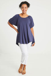 Model Noli wearing size 14 of the Sweet Melody Bamboo Tee in colour Navy (Blue), from the front, showing the whole outfit
