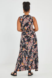 Model Noli wearing size 14 of the Life Is Beautiful Sleeveless Wrap Maxi in colour Blkpaisley (Black), from the back