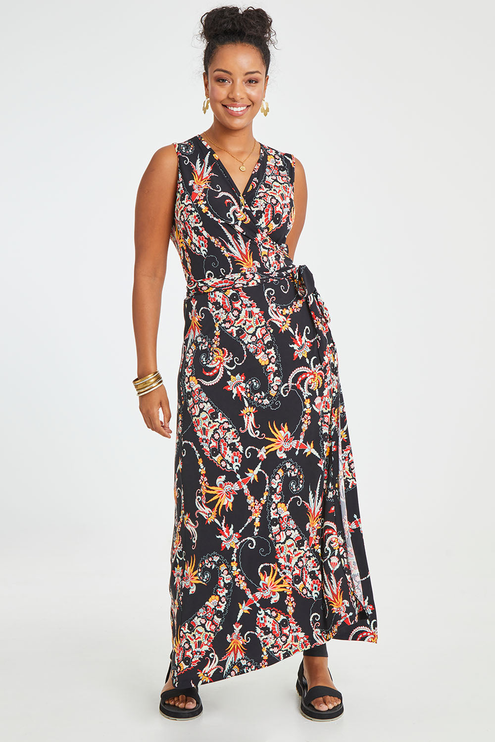 Model Noli wearing size 14 of the Life Is Beautiful Sleeveless Wrap Maxi in colour Blkpaisley (Black), from the front, showing the whole outfit